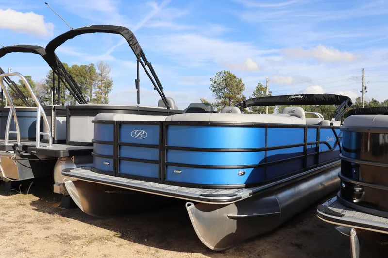 The Image of 2026 Bentley Pontoons Legacy 220 Navigator, blue pontoon boat, parked outdoors. - 0