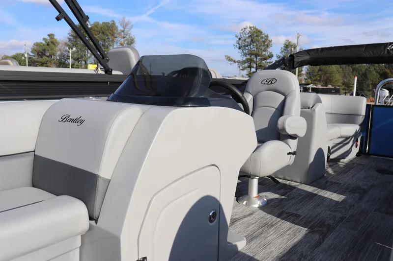 Slide: The Image of 2026 Bentley Pontoons Legacy 220 Navigator interior with luxurious seating and modern design. - 4