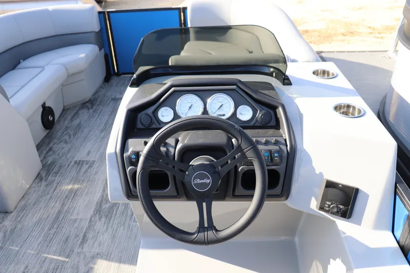 Slide: The Image of 2026 Bentley Pontoons Legacy 220 Navigator dashboard with steering wheel and gauges. - 5