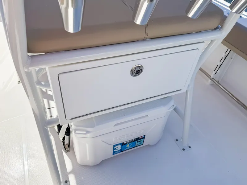 Slide: The Image of 2025 Edgewater 208CC boat interior with storage compartment and cooler. - 15