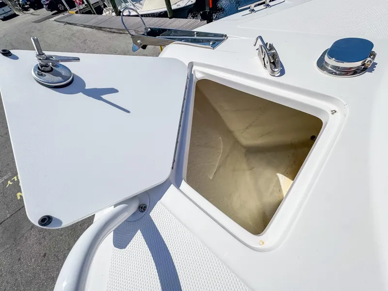 Slide: The Image of Open storage compartment on 2025 Edgewater 208CC boat deck. - 20