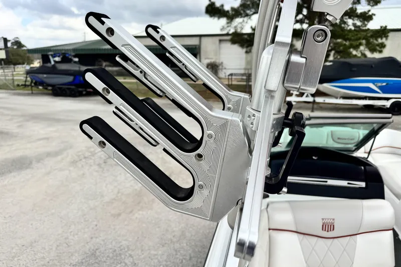 Slide: The Image of 2011 MasterCraft X25 boat with a close-up of a wakeboard rack. - 16