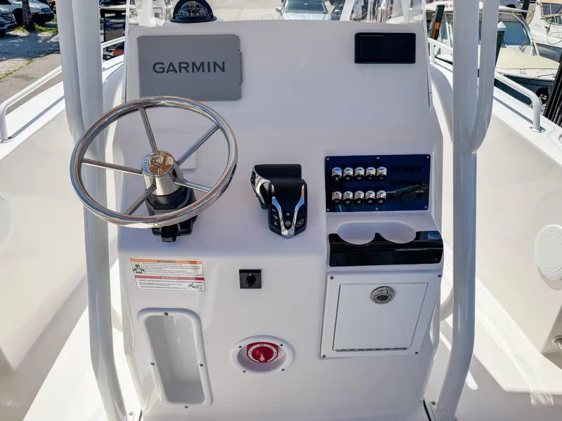 Slide: The Image of Edgewater 208CC 2025 boat console with Garmin navigation and control panel. - 12