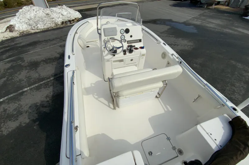 Slide: The Image of 2017 Tidewater 198 CC Adventure boat interior with steering console and seating. - 10