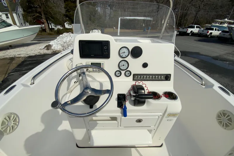 Slide: The Image of 2017 Tidewater 198 CC Adventure boat console with steering wheel and gauges. - 12