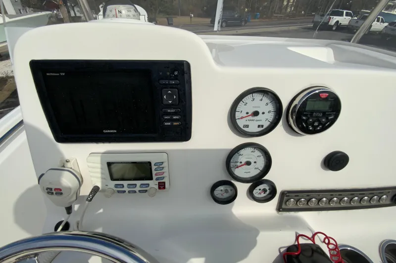 Slide: The Image of 2017 Tidewater 198 CC Adventure boat dashboard with Garmin GPS and various gauges. - 13
