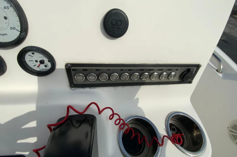 Slide: The Image of Control panel of 2017 Tidewater 198 CC Adventure boat with switches and gauges. - 15