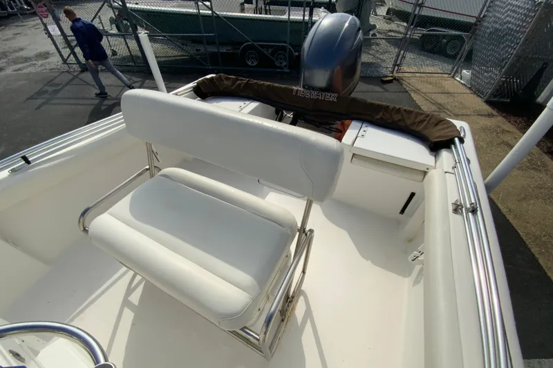 Slide: The Image of 2017 Tidewater 198 CC Adventure boat interior with seating and engine cover. - 16