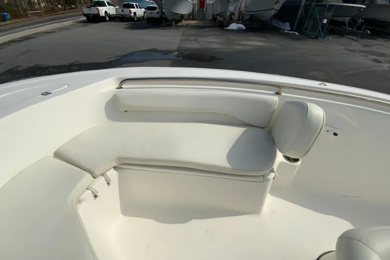 Slide: The Image of 2017 Tidewater 198 CC Adventure boat interior with white cushioned seating. - 19