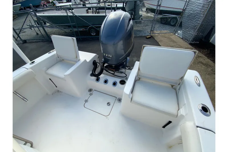 Slide: The Image of 2017 Tidewater 198 CC Adventure boat interior with seating and outboard motor. - 25
