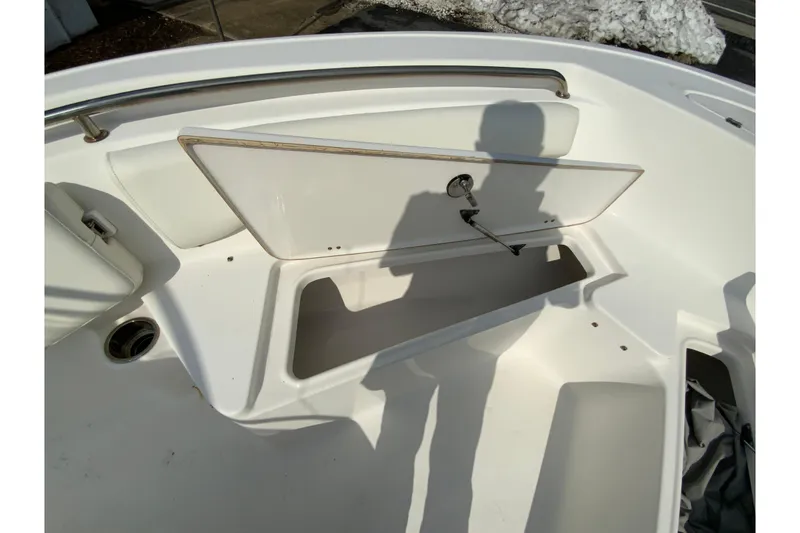 Slide: The Image of 2017 Tidewater 198 CC Adventure boat storage compartment with open hatch. - 28