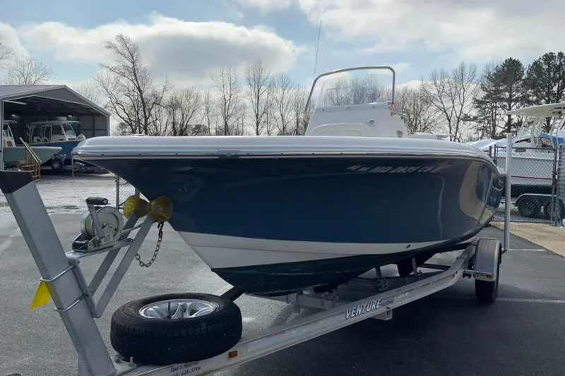 Slide: The Image of 2017 Tidewater 198 CC Adventure boat on trailer, parked outdoors. - 4