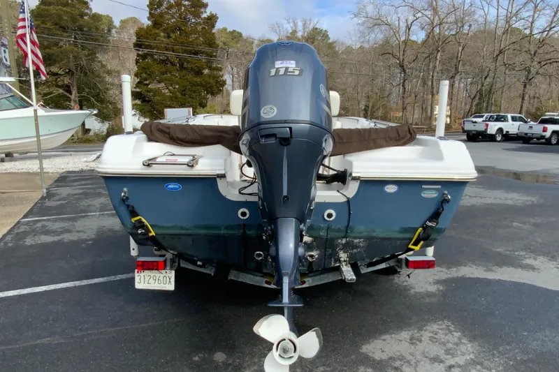 Slide: The Image of 2017 Tidewater 198 CC Adventure boat with Yamaha 115 outboard motor, parked outdoors. - 8