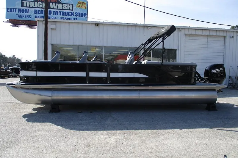 The Image of 2026 Bentley Pontoons Legacy 243 DL Navigator pontoon boat parked outdoors. - 1