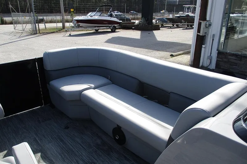 Slide: The Image of 2026 Bentley Pontoons Legacy 243 DL Navigator interior with sleek gray seating. - 11