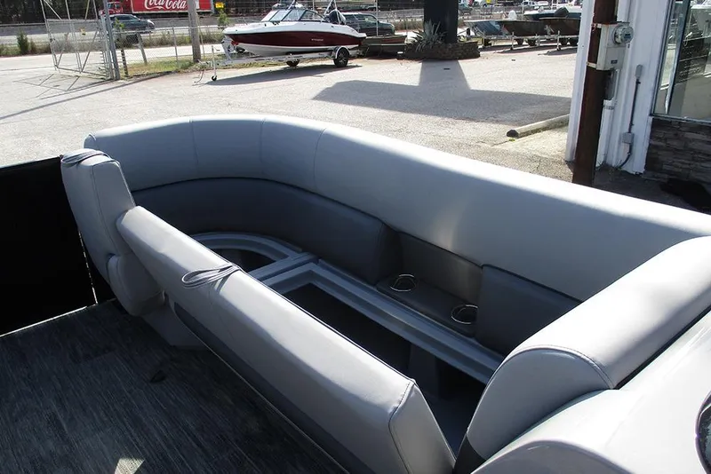Slide: The Image of 2026 Bentley Pontoons Legacy 243 DL Navigator interior with gray seating and cup holders. - 12