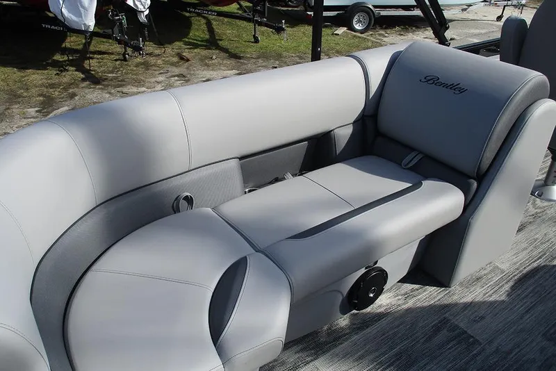 Slide: The Image of 2026 Bentley Pontoons Legacy 243 DL Navigator interior with luxurious gray seating. - 15