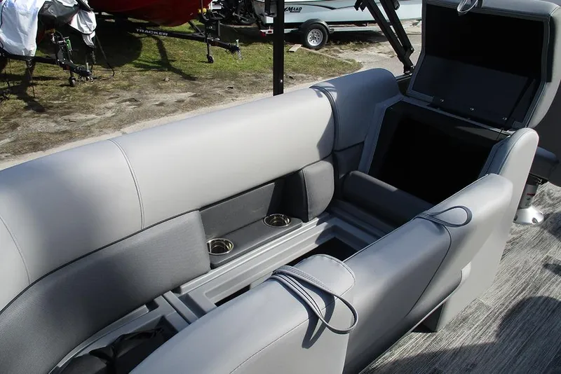 Slide: The Image of 2026 Bentley Pontoons Legacy 243 DL Navigator interior with gray seating and cup holders. - 16
