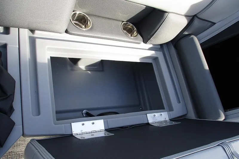 Slide: The Image of 2026 Bentley Pontoons Legacy 243 DL Navigator storage compartment with cup holders. - 18