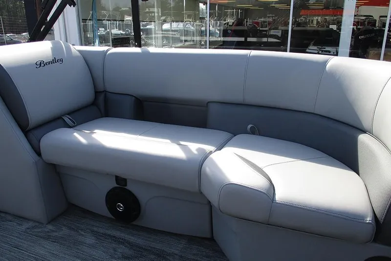 Slide: The Image of 2026 Bentley Pontoons Legacy 243 DL Navigator interior with luxurious gray seating. - 20