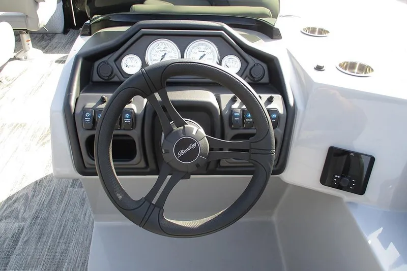 Slide: The Image of Steering console of 2026 Bentley Pontoons Legacy 243 DL Navigator with modern controls. - 25