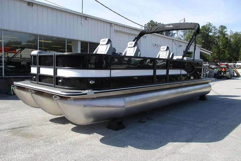 Slide: The Image of 2026 Bentley Pontoons Legacy 243 DL Navigator pontoon boat displayed outdoors. - 3