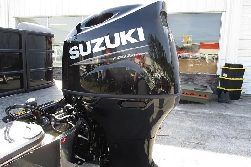 Slide: The Image of Suzuki four-stroke outboard motor on 2026 Bentley Pontoons Legacy 243 DL Navigator. - 9