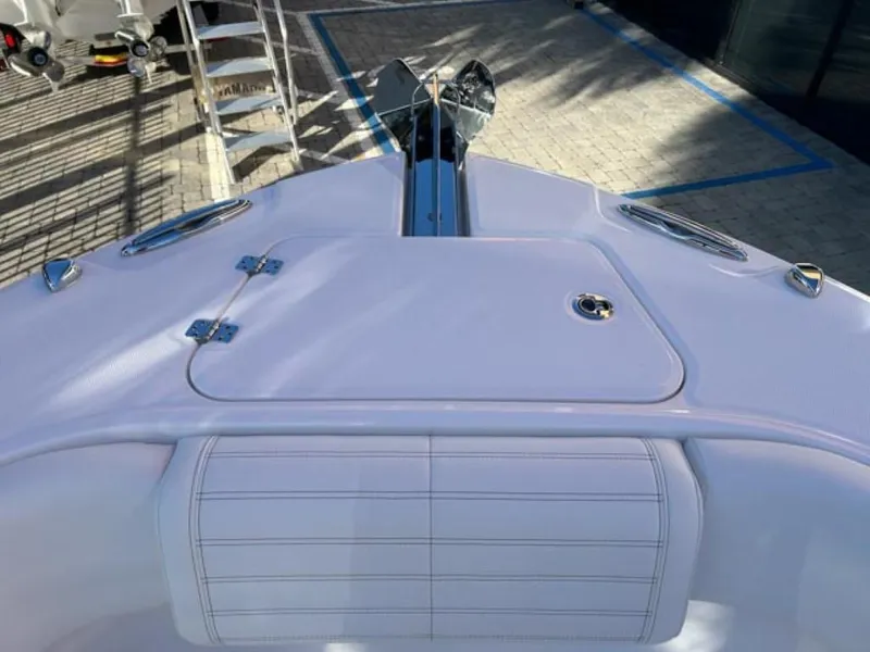 Slide: The Image of 2025 Edgewater 262CC boat deck with sleek design and storage compartment. - 26