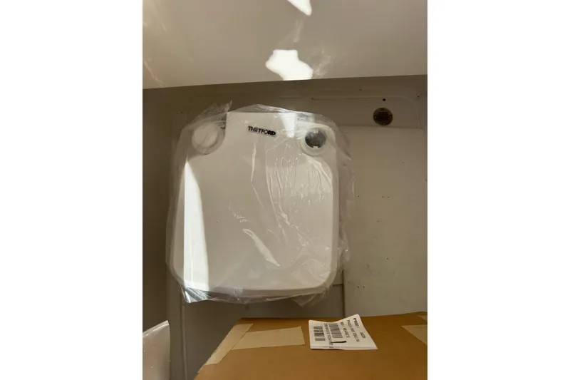 Slide: The Image of Thetford toilet in 2026 Robalo 246 Cayman boat interior. - 15