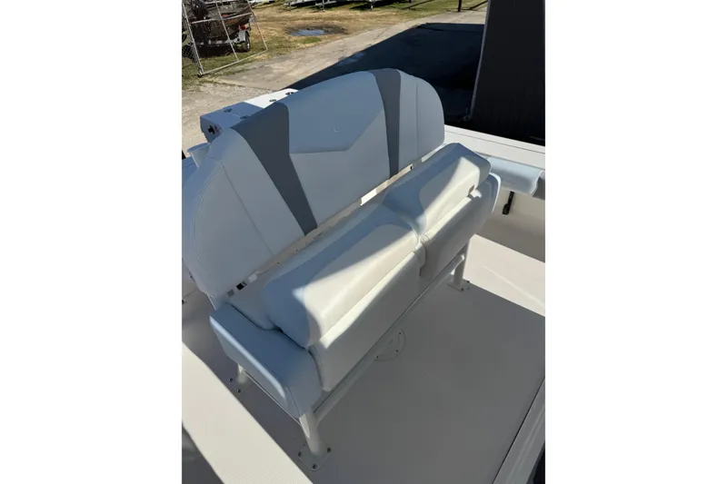 Slide: The Image of 2026 Robalo 246 Cayman boat seat with gray and white upholstery. - 17