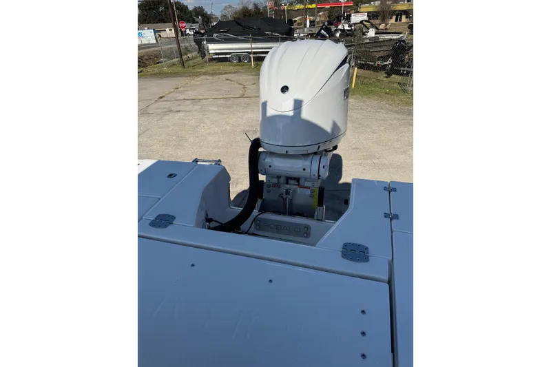 Slide: The Image of 2026 Robalo 246 Cayman boat engine view in outdoor setting. - 25