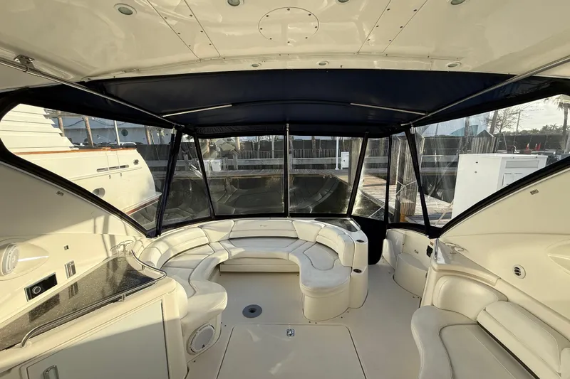 Slide: The Image of Luxurious 2007 Cruisers Yachts 560 Express interior with elegant seating and panoramic windows. - 10