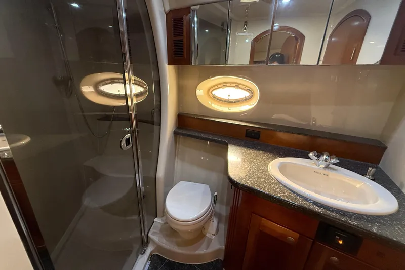 Slide: The Image of Luxurious bathroom in 2007 Cruisers Yachts 560 Express with modern fixtures and elegant design. - 20