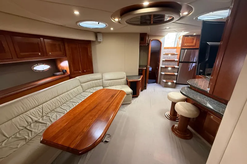 Slide: The Image of Luxurious interior of 2007 Cruisers Yachts 560 Express with elegant seating and wooden finishes. - 21