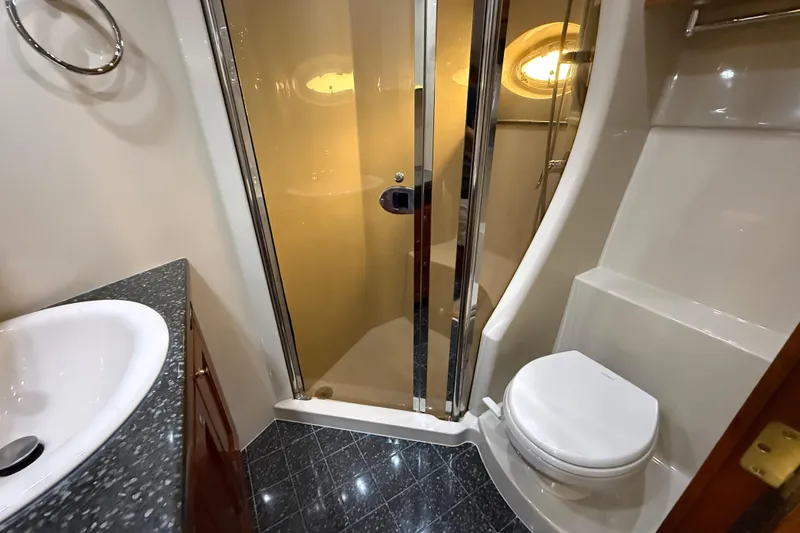 Slide: The Image of Luxurious bathroom in 2007 Cruisers Yachts 560 Express with shower and modern fixtures. - 24
