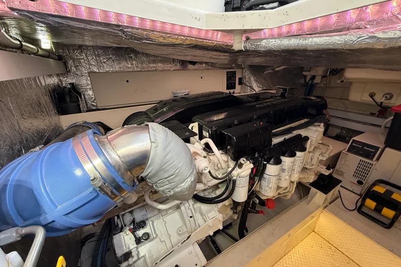 Slide: The Image of Engine room of 2007 Cruisers Yachts 560 Express, featuring a well-maintained marine engine. - 30