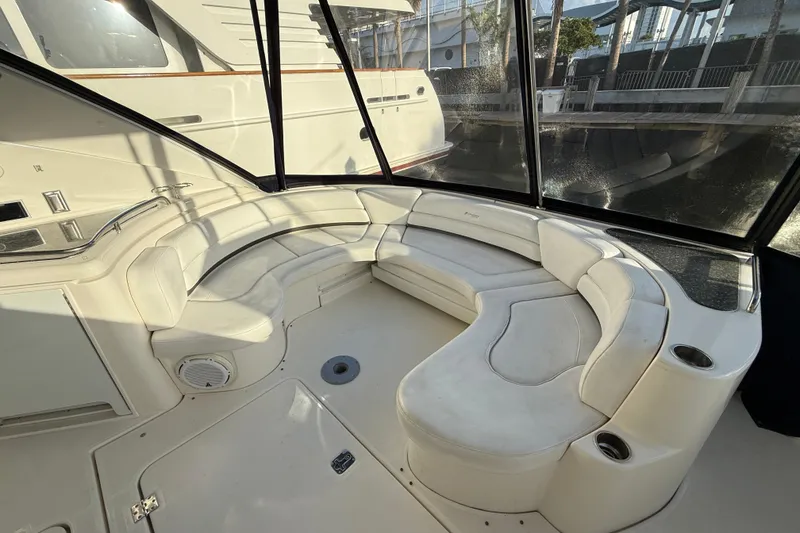 Slide: The Image of 2007 Cruisers Yachts 560 Express interior with white leather seating and panoramic windows. - 6