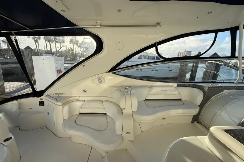 Slide: The Image of Luxurious 2007 Cruisers Yachts 560 Express interior with elegant seating and marina view. - 8