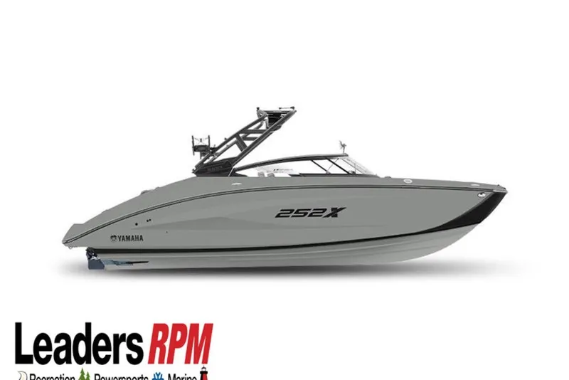 Slide: The Image of 2026 Yamaha Boats 252XE, sleek design, side view, displayed by Leaders RPM. - 1