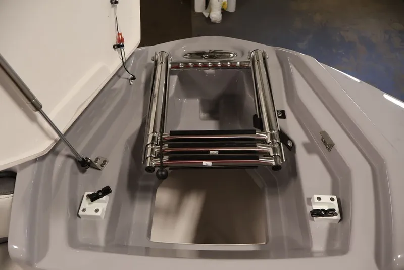 Slide: The Image of 2026 Yamaha Boats 252XE bow with stainless steel ladder and storage compartment. - 34