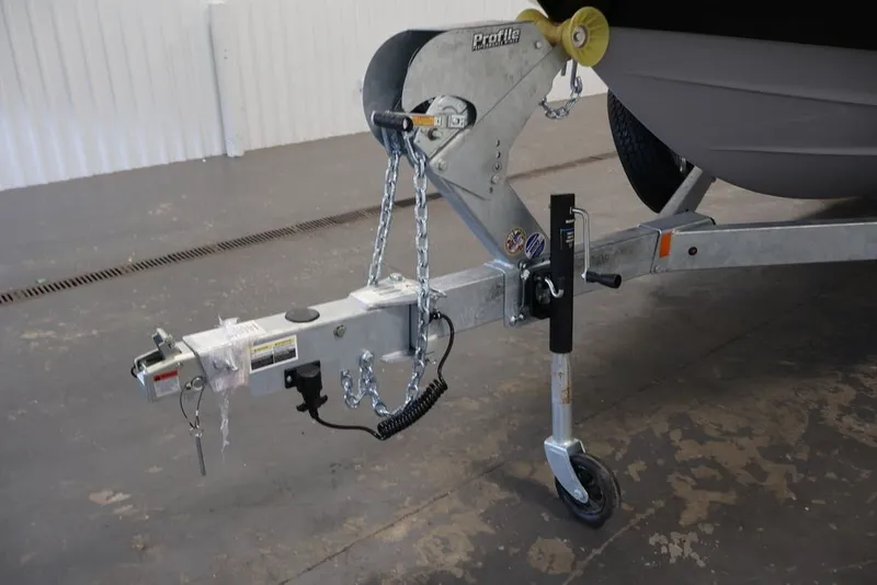 Slide: The Image of Trailer hitch of 2026 Yamaha Boats 252XE with chains and wheel support. - 53