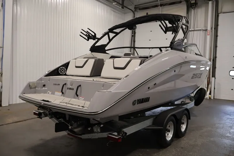 Slide: The Image of 2026 Yamaha Boats 252XE on trailer in indoor storage facility. - 6
