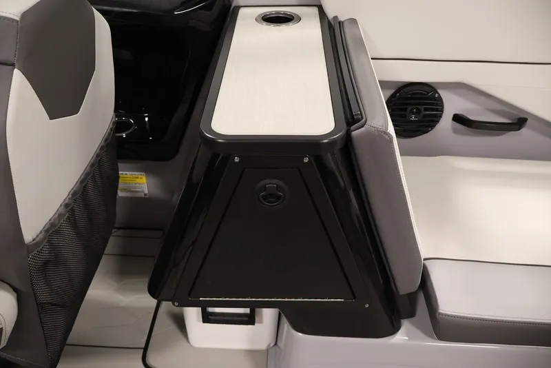 Slide: The Image of Interior of 2026 Yamaha Boats 252XE, featuring seating and storage compartment. - 13