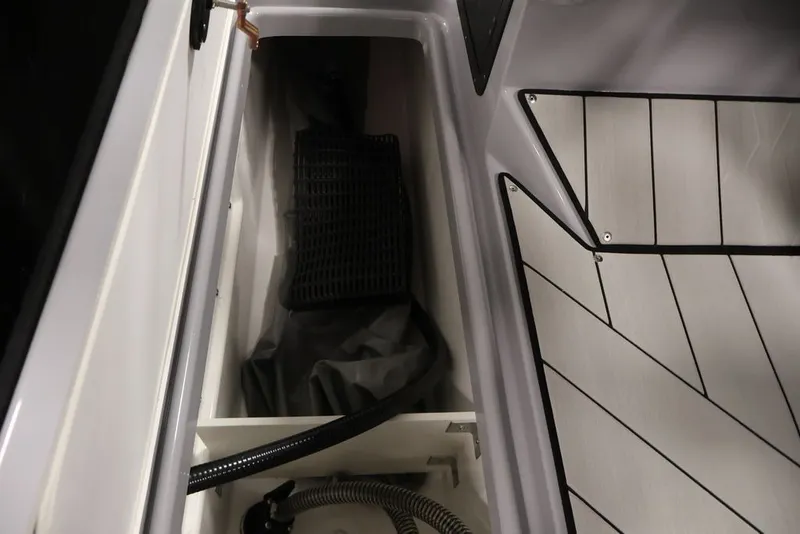 Slide: The Image of Storage compartment in 2026 Yamaha Boats 252XE, featuring sleek interior design and modern materials. - 14
