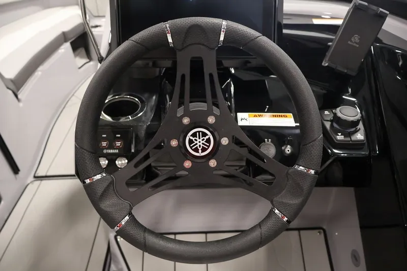 Slide: The Image of Steering wheel of 2026 Yamaha Boats 252XE, featuring modern controls and sleek design. - 46