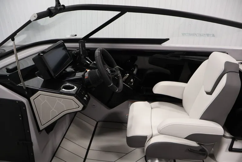 Slide: The Image of 2026 Yamaha Boats 252XE cockpit with modern steering and comfortable seating. - 36
