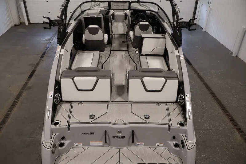 Slide: The Image of 2026 Yamaha Boats 252XE interior, showcasing sleek seating and modern design in a spacious layout. - 54