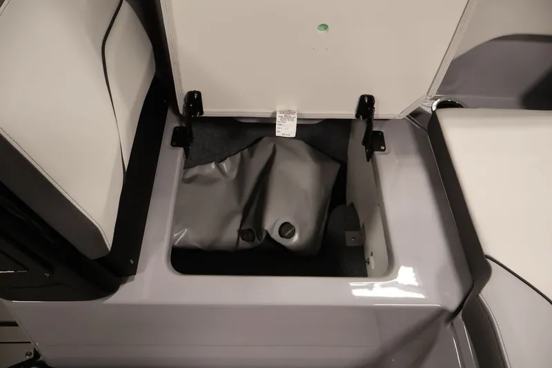 Slide: The Image of Open storage compartment in 2026 Yamaha Boats 252XE, showcasing interior space. - 10