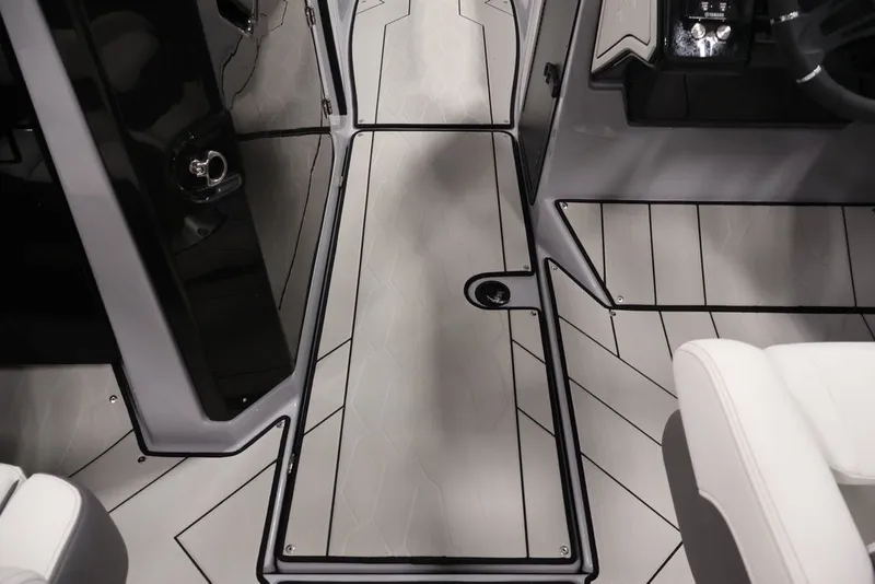 Slide: The Image of 2026 Yamaha Boats 252XE interior with sleek, modern flooring and white seating. - 9