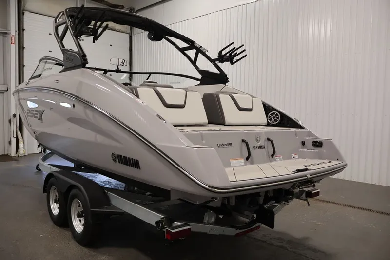 Slide: The Image of 2026 Yamaha Boats 252XE on trailer in indoor storage facility. - 55